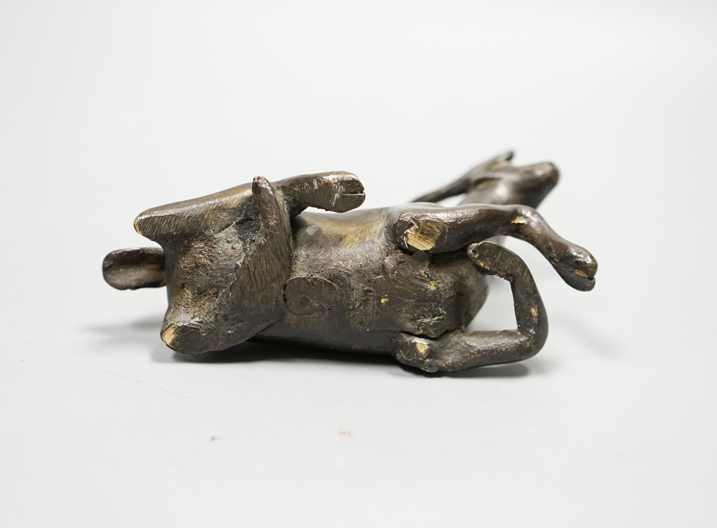 A Chinese early bronze figure of a deer, probably Yuan to Ming period, 13.5cm